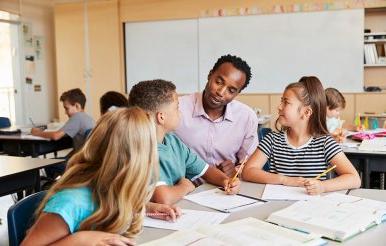 Teacher Working with Students